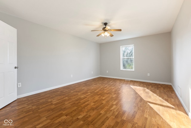 unfurnished room with ceiling fan and wood-type flooring