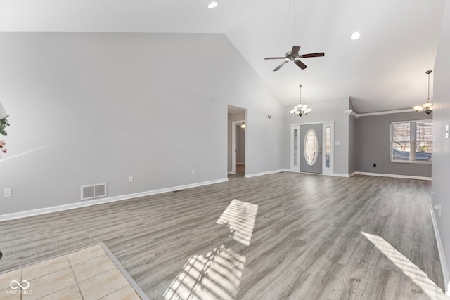 2395 W Robin Rd, Scottsburg, IN 47170 - unfurnished living room featuring high vaulted ceiling, ceiling fan, a chandelier, wood finished floors, and recessed lighting