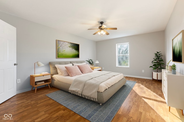 bedroom featuring wood-type flooring and ceiling fan