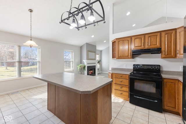 2395 W Robin Rd, Scottsburg, IN 47170 - kitchen with black range with electric cooktop, vaulted ceiling, under cabinet range hood, light tile patterned floors, and brown cabinets