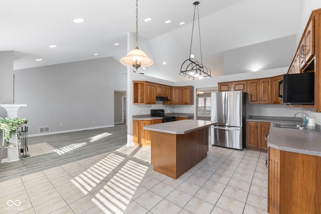 kitchen with a center island, sink, high vaulted ceiling, pendant lighting, and black appliances