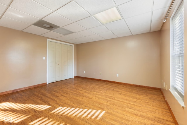 2395 W Robin Rd, Scottsburg, IN 47170 - unfurnished bedroom featuring light wood finished floors, a closet, and a drop ceiling