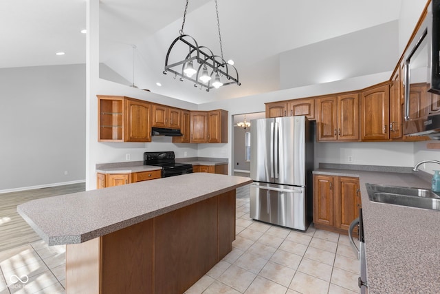 2395 W Robin Rd, Scottsburg, IN 47170 - kitchen featuring stainless steel appliances, lofted ceiling, light tile patterned floors, a chandelier, and brown cabinets