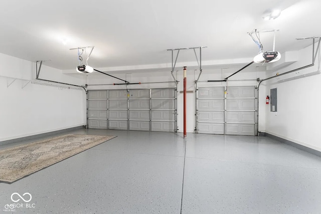 garage featuring a garage door opener and electric panel