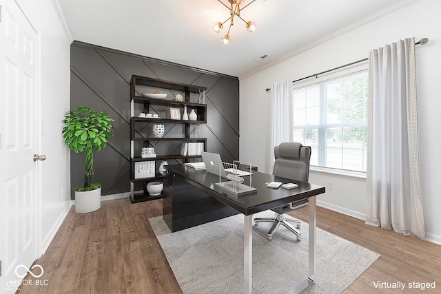 home office featuring crown molding, wood-type flooring, and an inviting chandelier