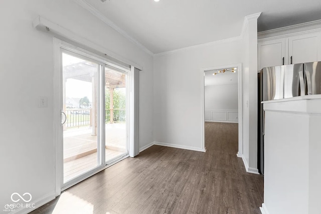 interior space with dark wood-type flooring and ornamental molding