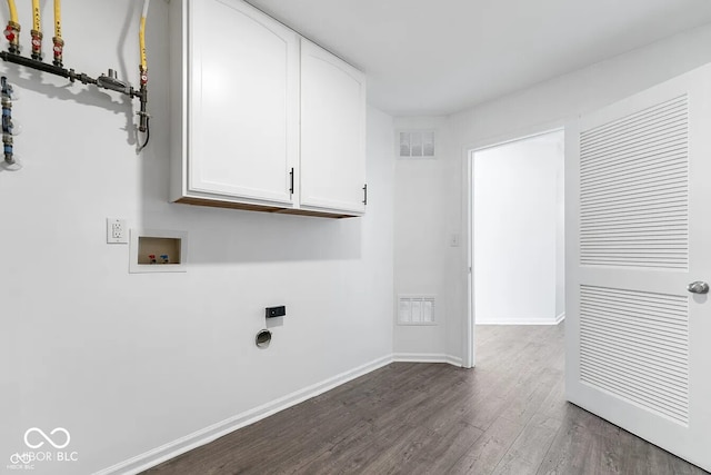 laundry area featuring washer hookup, hookup for an electric dryer, cabinets, and dark wood-type flooring