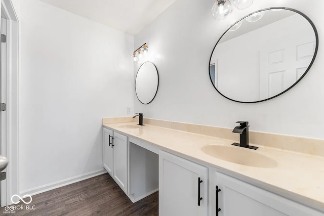 bathroom with vanity and wood-type flooring