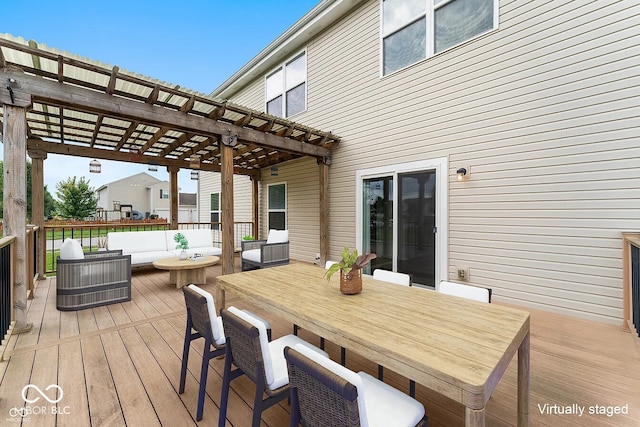 wooden terrace featuring a pergola and an outdoor hangout area