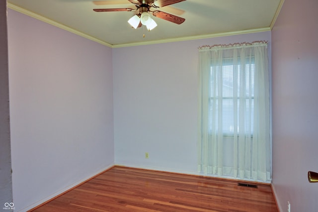 unfurnished room featuring ceiling fan, ornamental molding, and hardwood / wood-style flooring