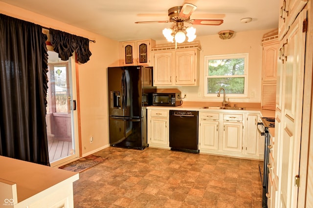 kitchen with black appliances, ceiling fan, and sink