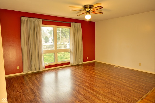 spare room featuring ceiling fan and hardwood / wood-style flooring