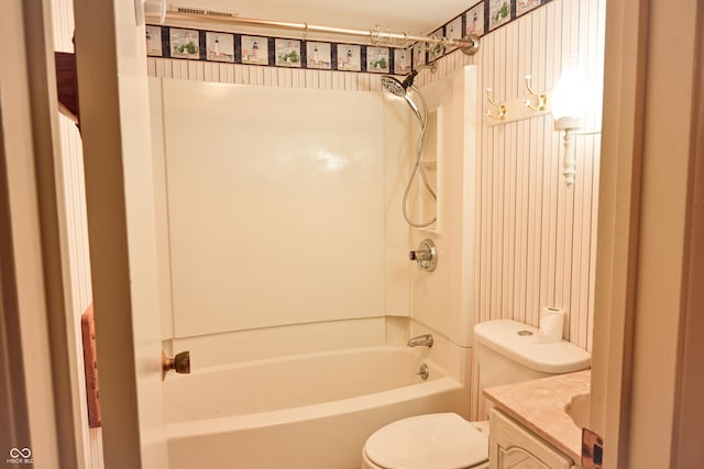 full bathroom featuring vanity, shower / bath combination, and toilet