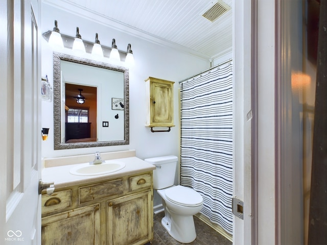 bathroom featuring walk in shower, vanity, and toilet