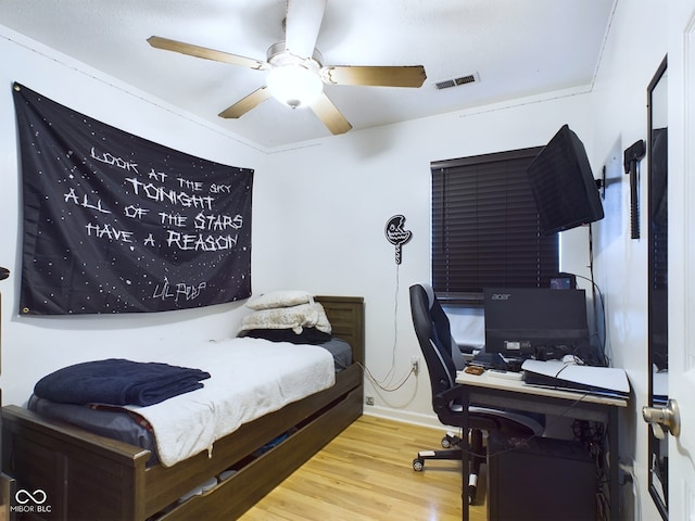 bedroom featuring wood-type flooring and ceiling fan