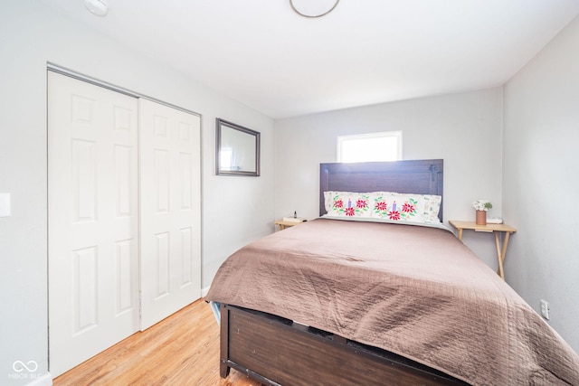 bedroom featuring a closet and light hardwood / wood-style floors