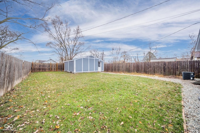 view of yard with an outbuilding and central AC unit