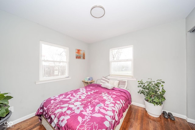 bedroom featuring dark wood-type flooring