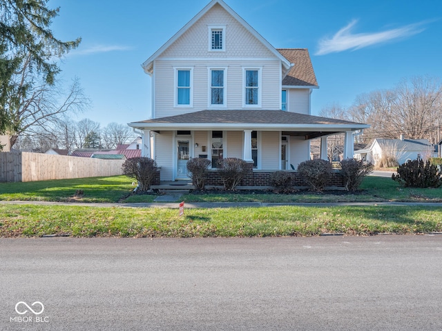 view of front of property featuring a porch and a front lawn