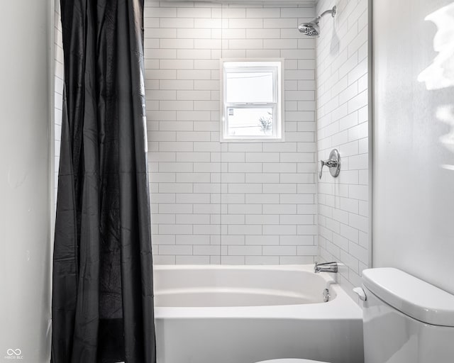 bathroom with toilet and shower / bath combo with shower curtain