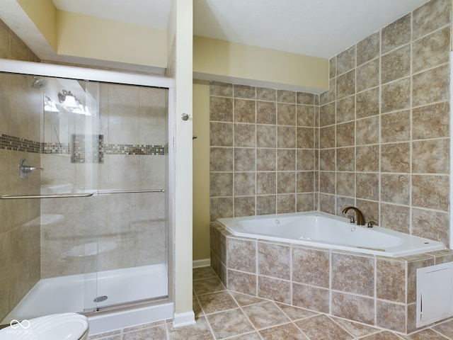 bathroom with separate shower and tub and tile patterned flooring