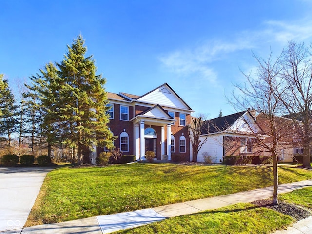 neoclassical / greek revival house with a front lawn