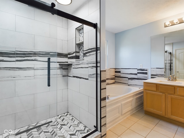 bathroom featuring separate shower and tub, tile patterned floors, vanity, and tile walls