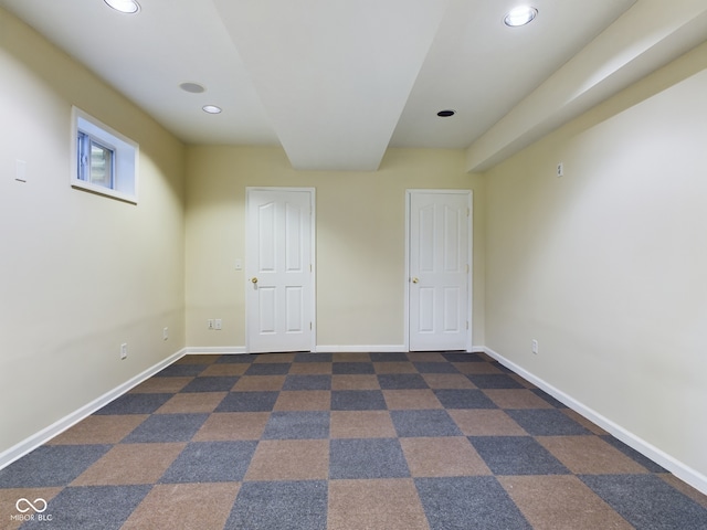 unfurnished bedroom with dark carpet