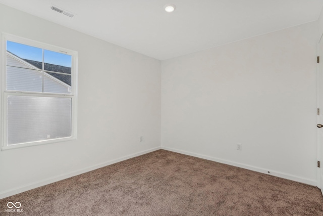 empty room featuring carpet floors