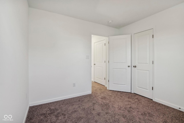 unfurnished bedroom featuring carpet