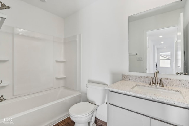 full bathroom with vanity, shower / bathtub combination, toilet, and wood-type flooring