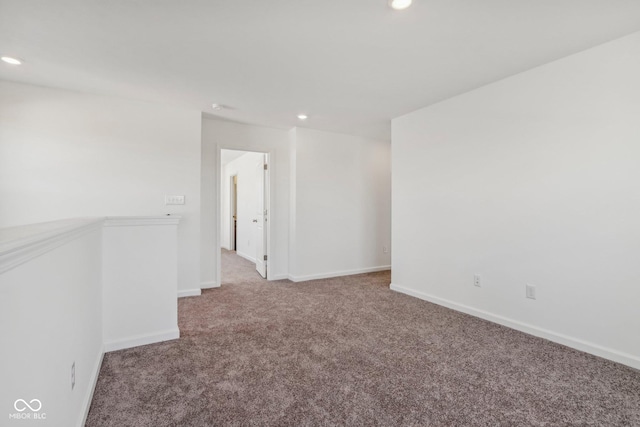 unfurnished room featuring carpet