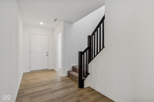 entryway with light hardwood / wood-style flooring