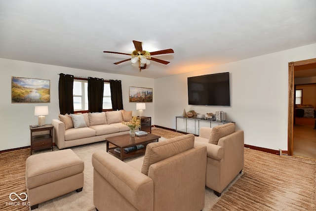 living room with ceiling fan and light carpet