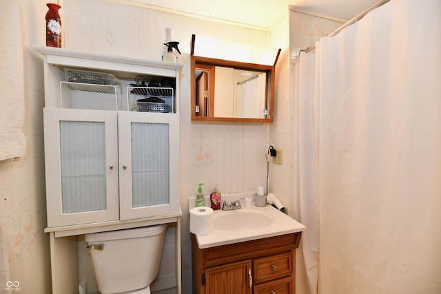 bathroom featuring a shower with curtain, vanity, tile walls, and toilet