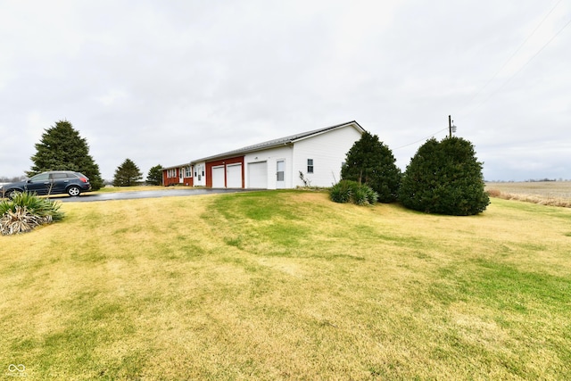 view of yard featuring a garage