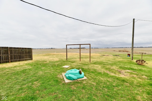 view of yard with a rural view