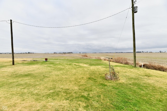 view of yard with a rural view