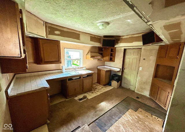 kitchen featuring sink and tile counters