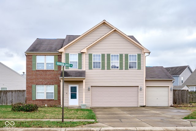 front of property featuring a front lawn and a garage