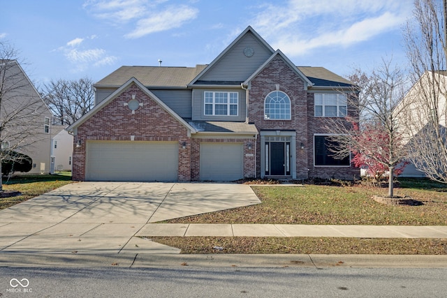 view of front of house featuring a garage and a front lawn