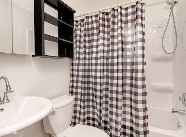 full bathroom featuring shower / bath combination with curtain, toilet, and sink