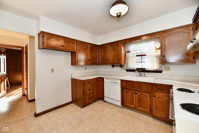 kitchen featuring white appliances and sink