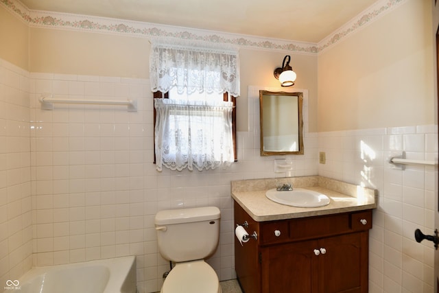 bathroom featuring vanity, toilet, tile walls, and a tub