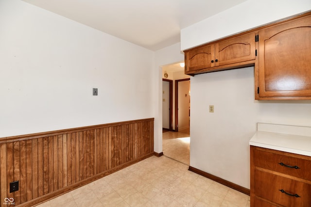 kitchen featuring wood walls