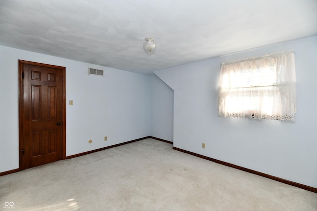 bonus room with light carpet