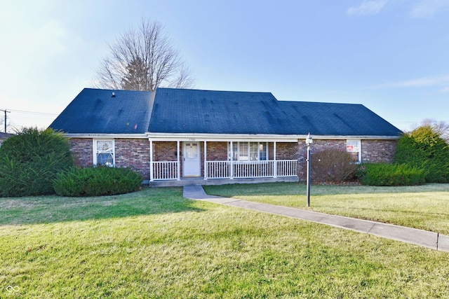 single story home featuring a front lawn and a porch