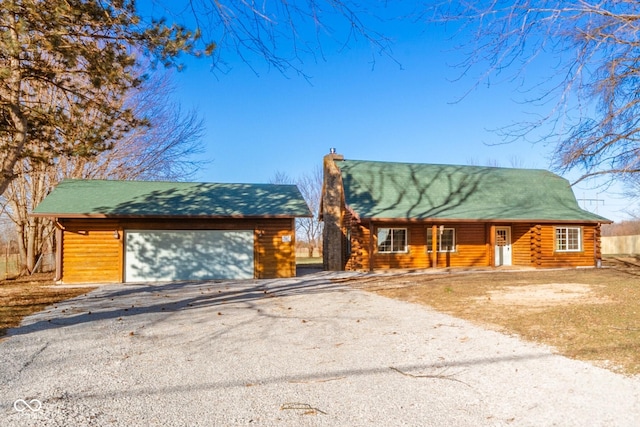 log cabin with a garage