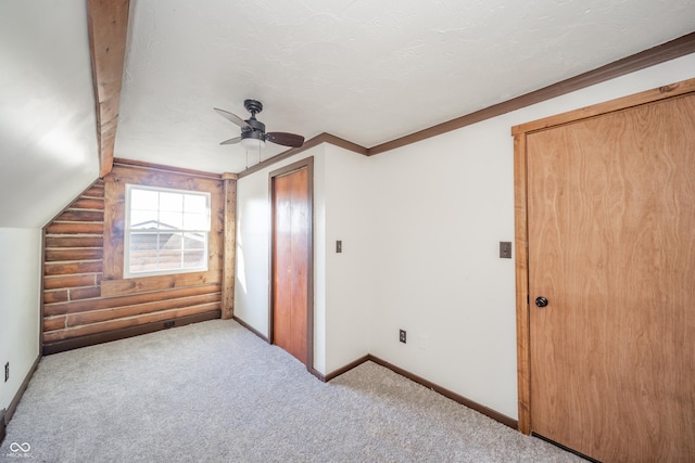 additional living space with carpet flooring, ceiling fan, and lofted ceiling