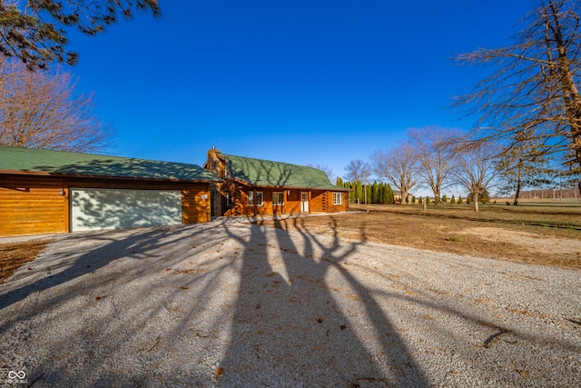 view of front of house featuring covered porch and a garage